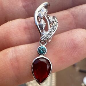 RARE solid platinum genuine blue/white diamond/ red labradorite/
 pendant$3800
